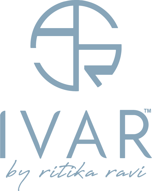 Elegant blue logo with stylized letters and "IVAR by ritika ravi."