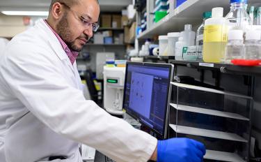 Leukemia specialist and cellular therapist Anthony Daniyan, MD, working in an MSK lab.