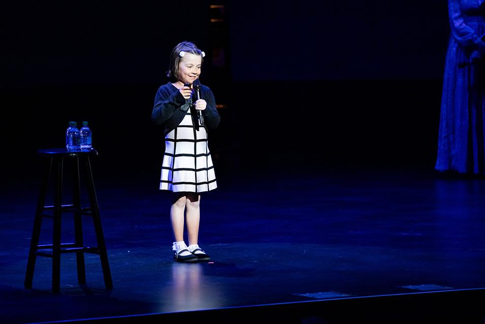 Audrey Lorenz performing on stage at Comedy vs Cancer 2019. 