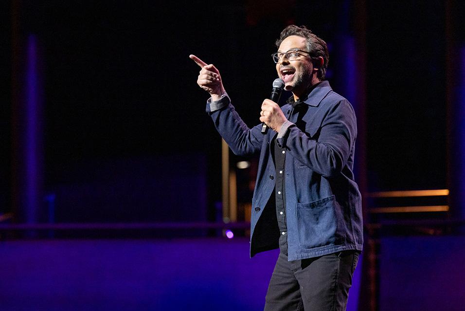 Nick Kroll performing on stage at Comedy vs Cancer 2024.