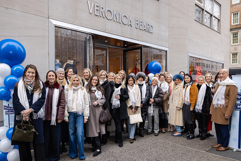 Society Members standing outside the Veronica Beard store in New York City with Dr. Andrew Kung, Chair of the Department of Pediatrics at MSK.
